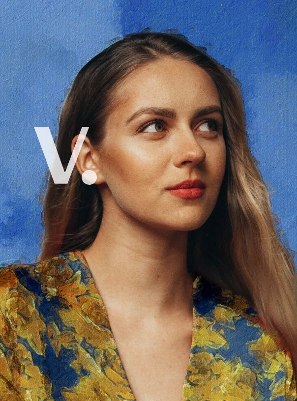 Portrait of a woman with long hair, wearing a floral blouse against a blue textured background, with the letter "V" overlaying the image.