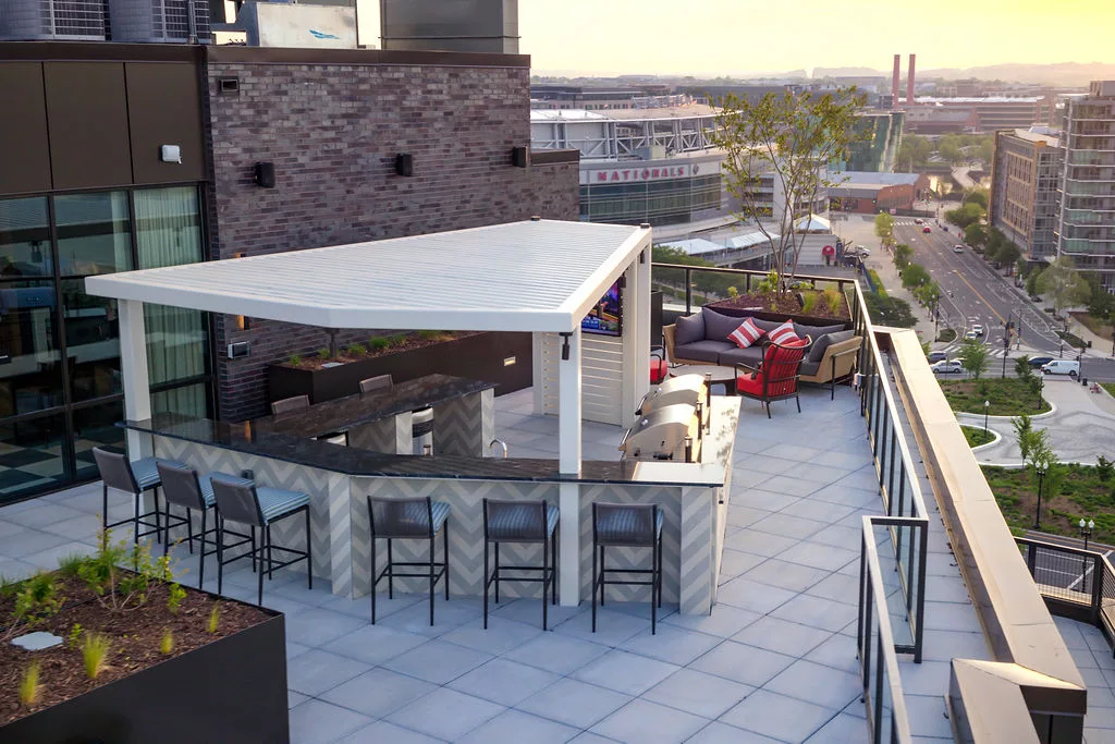 Rooftop kitchen and seating area overlooking Nationals Park stadium.