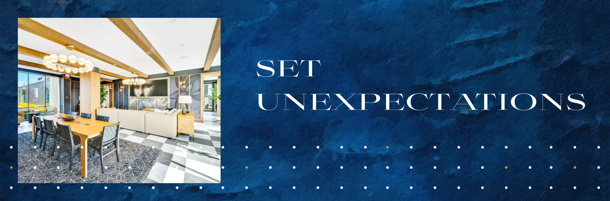 A photo of a lounge with a long wooden table surrounded by chairs and a sofa and fireplace in the background, next to text saying "Set Unexpectations", on a textured blue background.